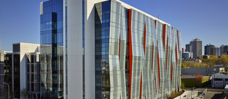 The South Lake Union building reflecting the city skyline in it's windows.